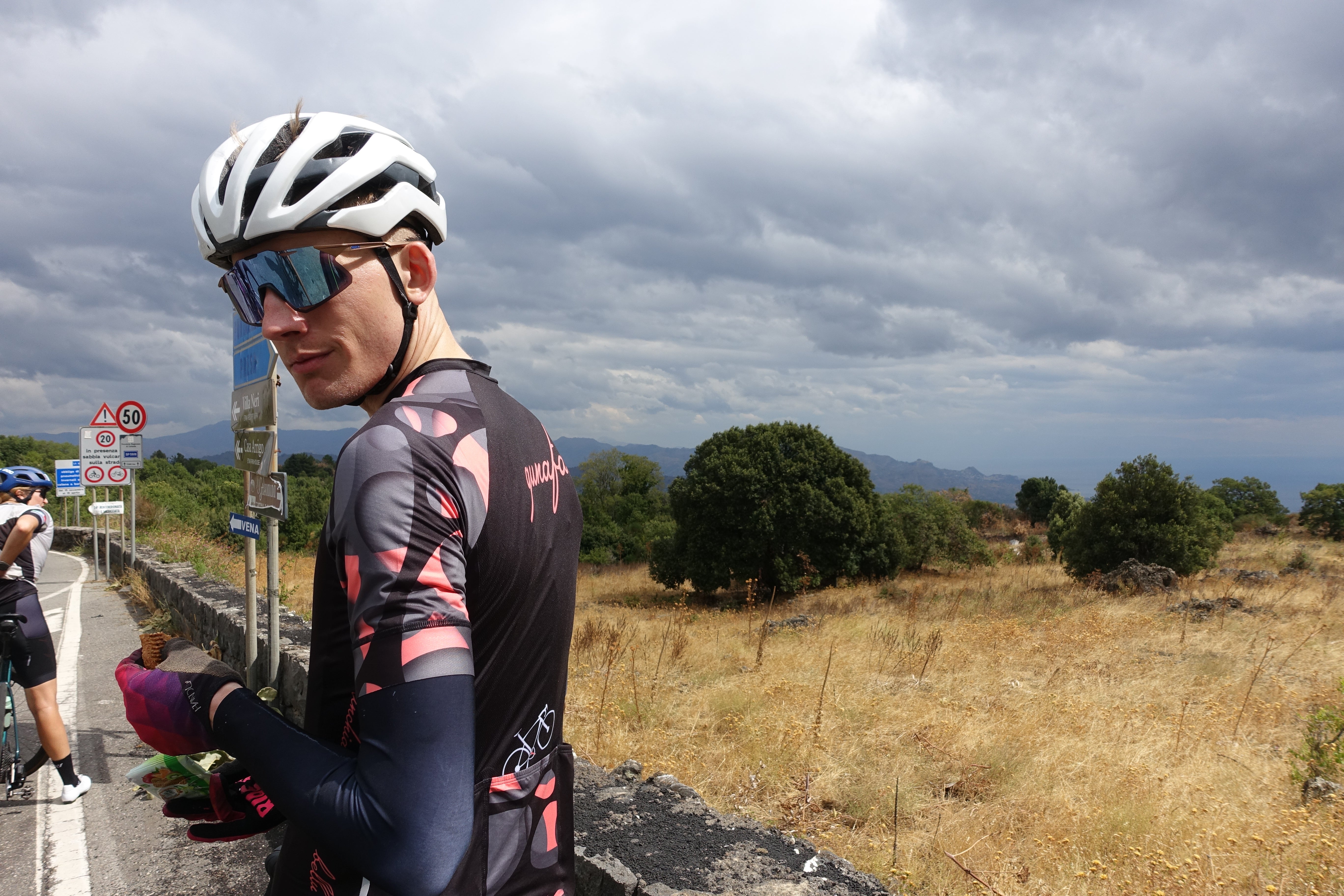 Cyclist riding through Madonie mountain roads in East Sicily — Qunafa guided cycling tour