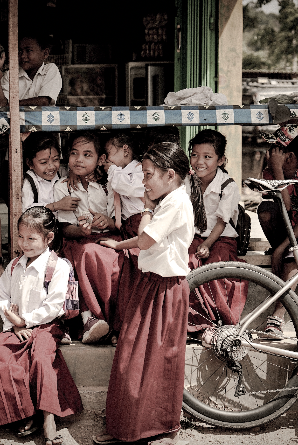 Qunafa Bali cycling tour guide with local children — authentic cultural experience