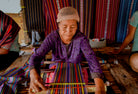 A SASAK lady creating a fabric from scratch. by Qunafa Travel